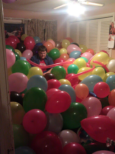 Walnut in a room full of balloons. Walnut in a room full of balloons.